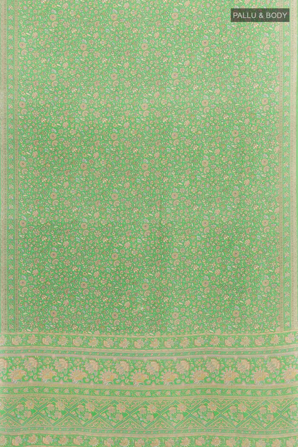 Flat view of Green Crepe SareePrinted design on the body and Printed Border