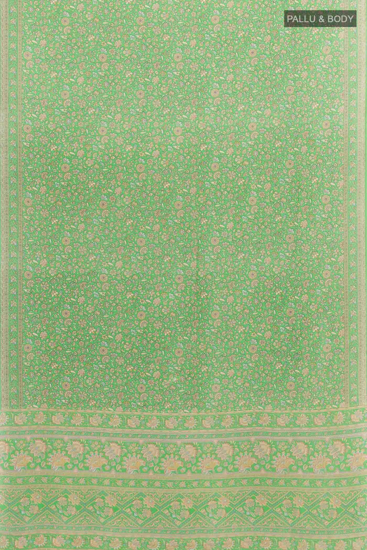 Flat view of Green Crepe SareePrinted design on the body and Printed Border