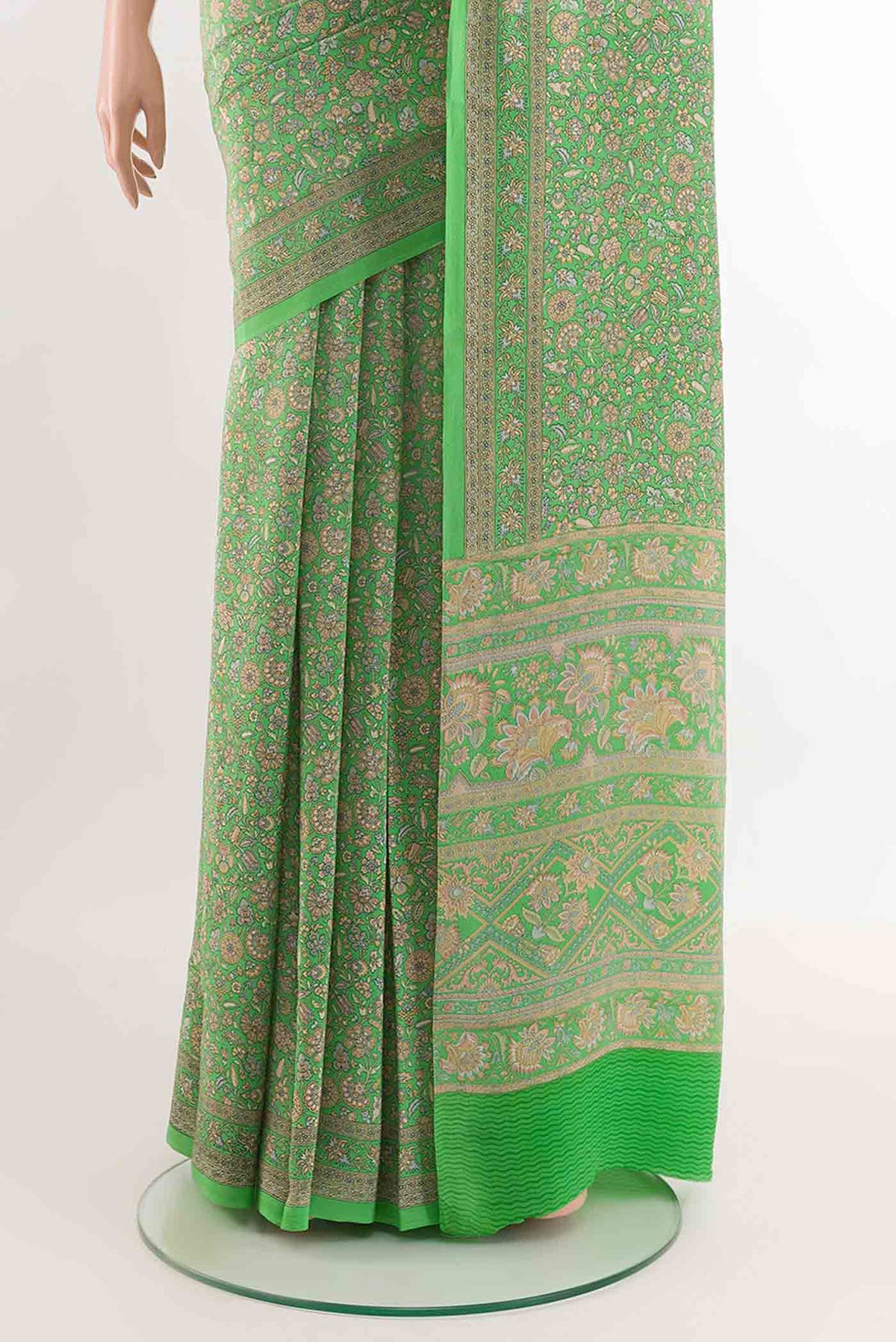 Pleats and pallu of Green Crepe SareePrinted design on the body and Printed Border