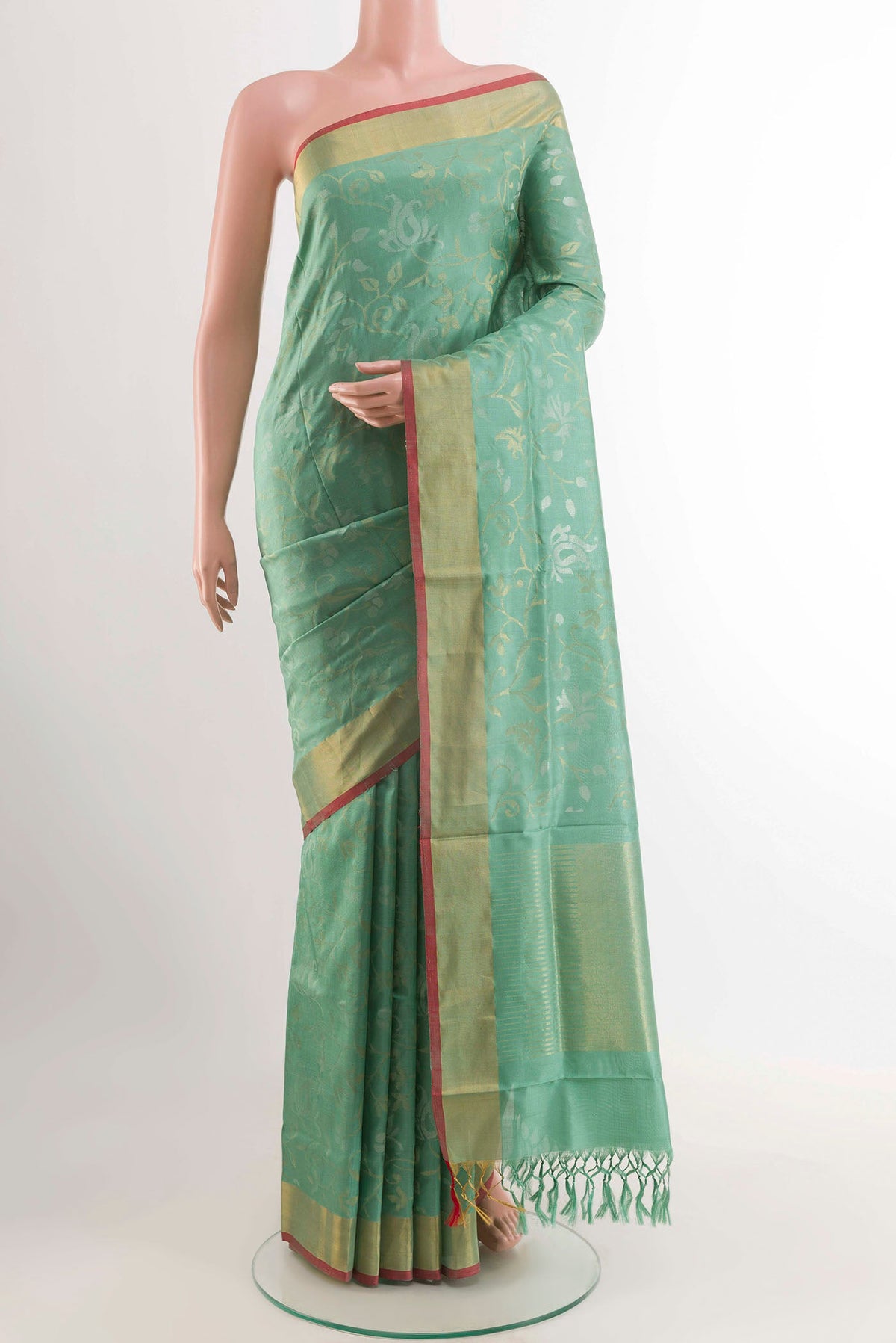 Pure Silk Pure Zari Sage Green Uppada Saree with Zari Brocade on the body and Zari Border displayed on a mannequin