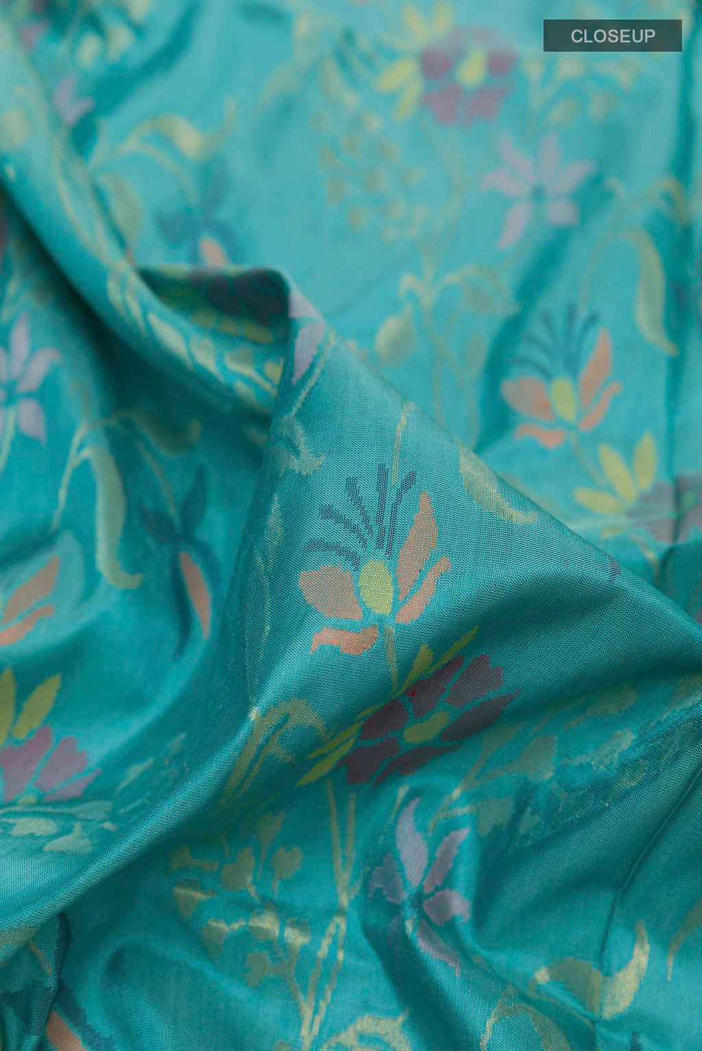 Close up of Pure Silk Pure Zari Blue Uppada Saree with Zari Brocade on the body and Zari Border displaying folds