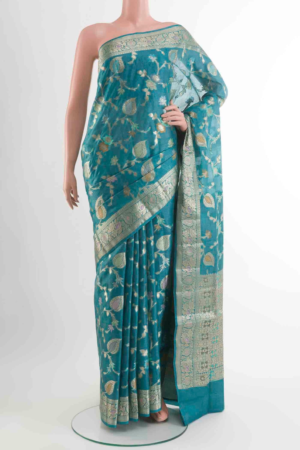 Blue Banarasi Tussar Silk Saree with Zari And Thread Butta on the body and Zari Border displayed on a mannequin