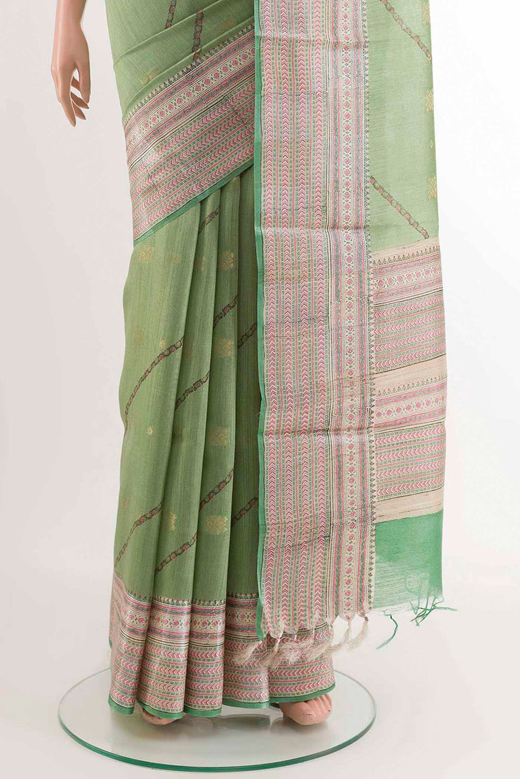Pleats and pallu of Green Tussar Saree with Stripes on the body and Printed Border