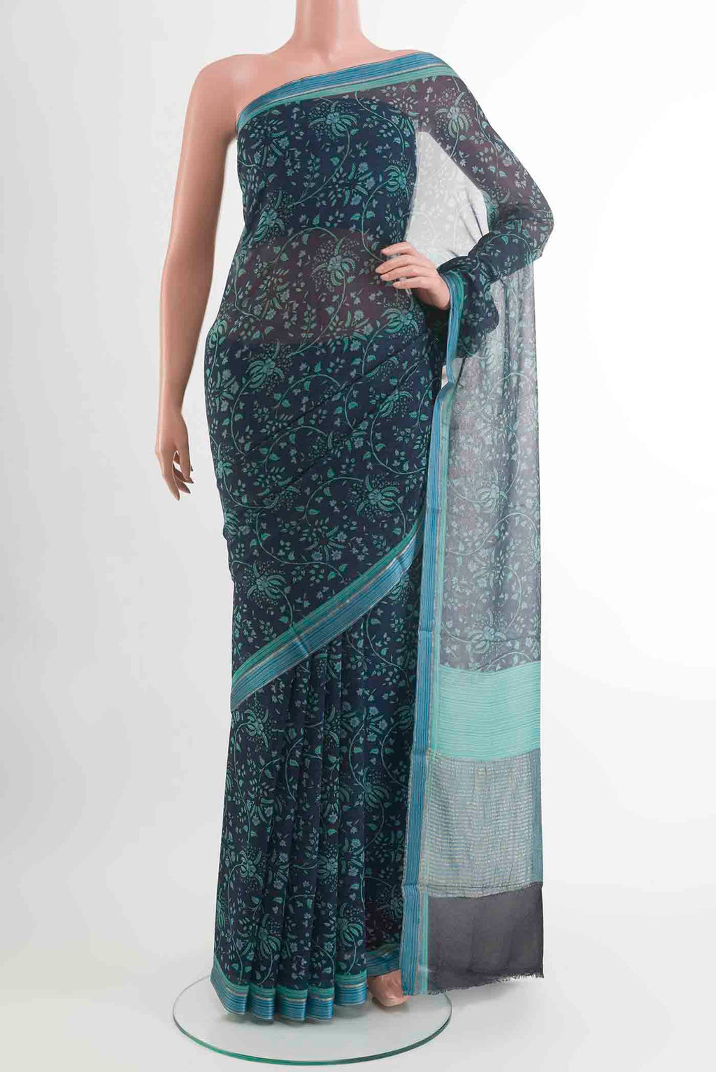 Peacock Blue Mysore Chiffon Saree with Printed design on the body and Zari Border displayed on a mannequin