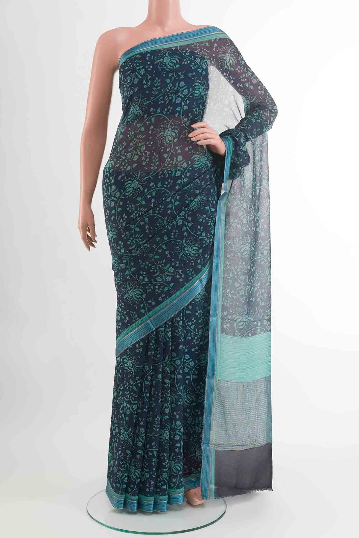 Peacock Blue Mysore Chiffon Saree with Printed design on the body and Zari Border displayed on a mannequin