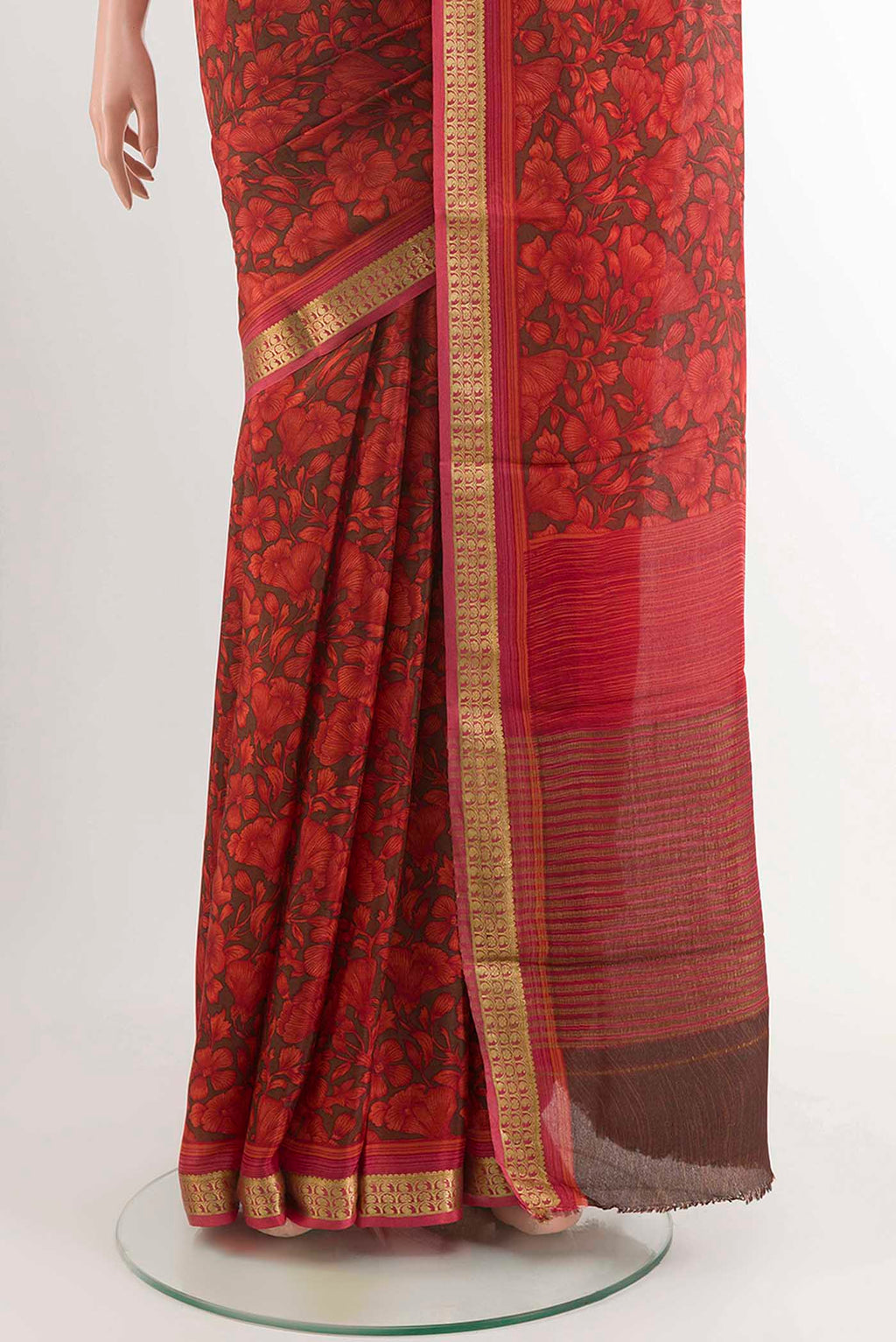 Pleats and pallu of Red Crepe Saree With Printed design on the body and Zari Border