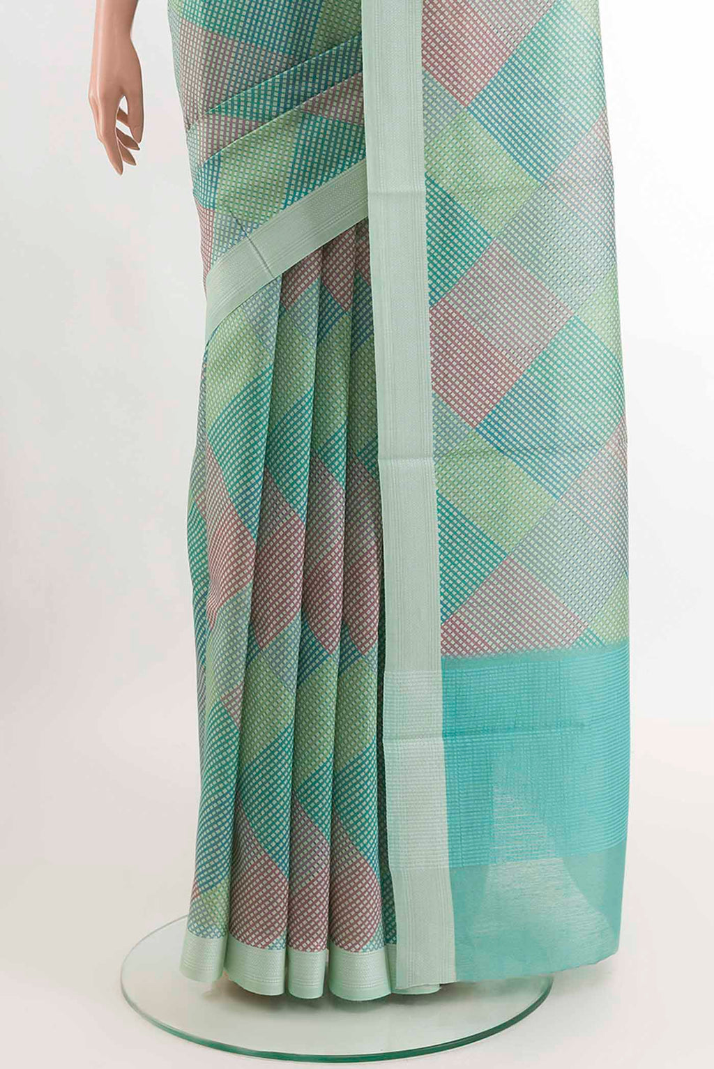 Pleats and pallu of Teal Tussar SareePrinted design on the body and Embroidery Border