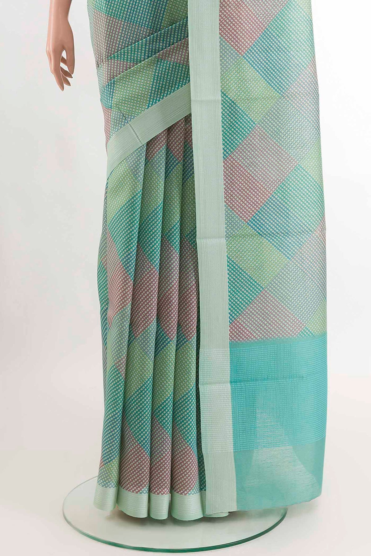 Pleats and pallu of Teal Tussar SareePrinted design on the body and Embroidery Border