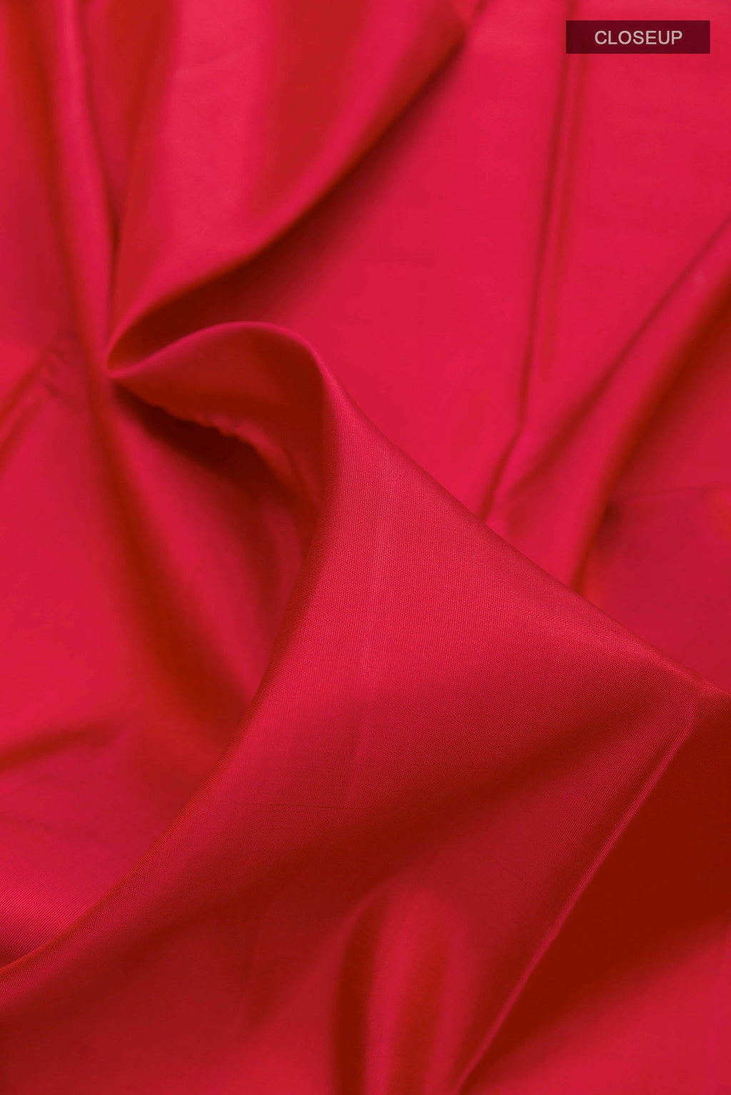 Close up of Maroon Kanchipuram Silk Saree with Plain Body and Rising Temple Border displaying folds