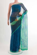 Peacock Blue Mysore Chiffon Saree with Printed design on the body and Zari Border displayed on a mannequin