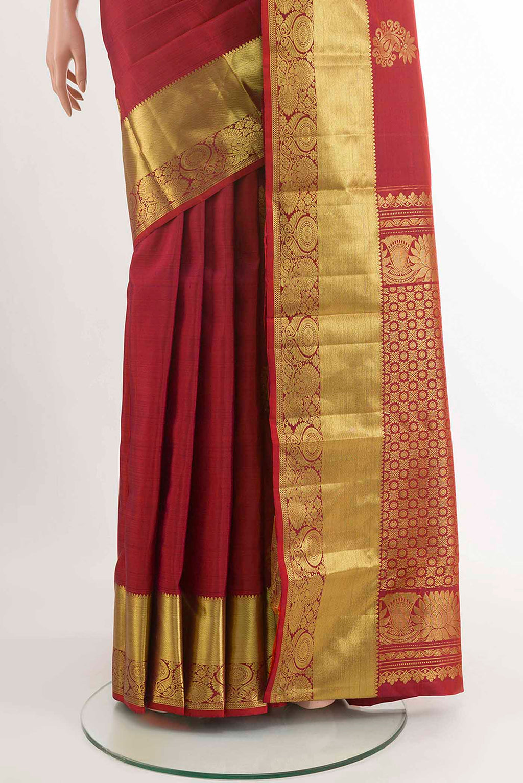 Pleats and pallu of Deep Red Kanchipuram Silk Saree with Zari Butta on the body and Zari Border