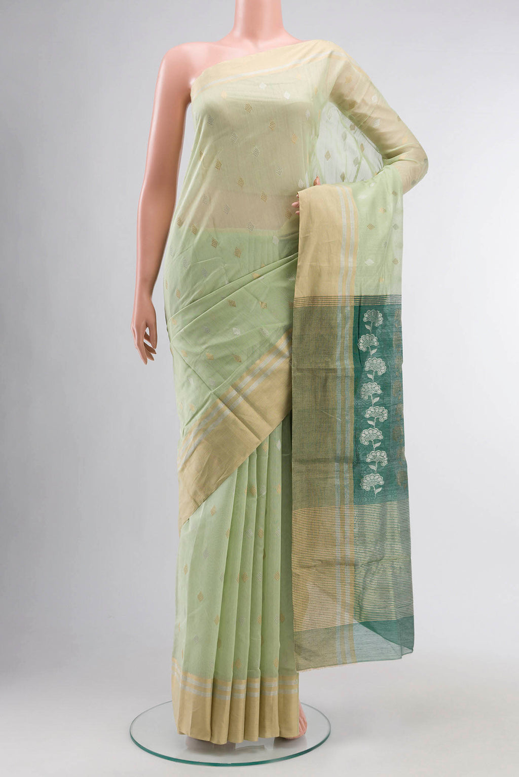 Green Chanderi Silk Cotton Saree with Zari Butta on the body and Zari Border displayed on a mannequin
