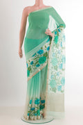 Green Mysore Chiffon Saree with Printed design on the body and Zari Border.  displayed on a mannequin