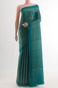 Blue Mysore Crepe Saree with Stripes on the body and Zari Border.  displayed on a mannequin
