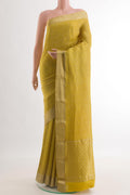 Mustard Mysore Crepe Saree with Zari Brocade on the body and Zari Border.  displayed on a mannequin