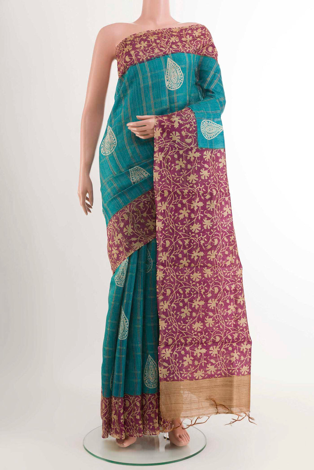 Blue Tussar Saree with Checked design on the body and Zari Border displayed on a mannequin