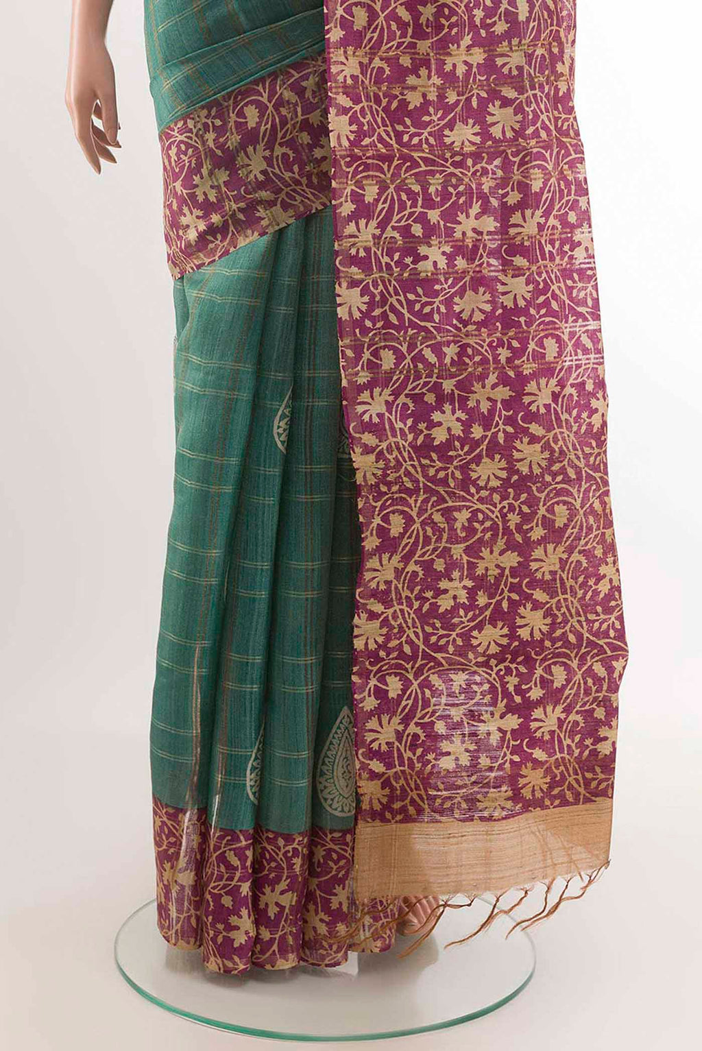 Pleats and pallu of Turquoise Tussar Saree with Checked design on the body and Zari Border