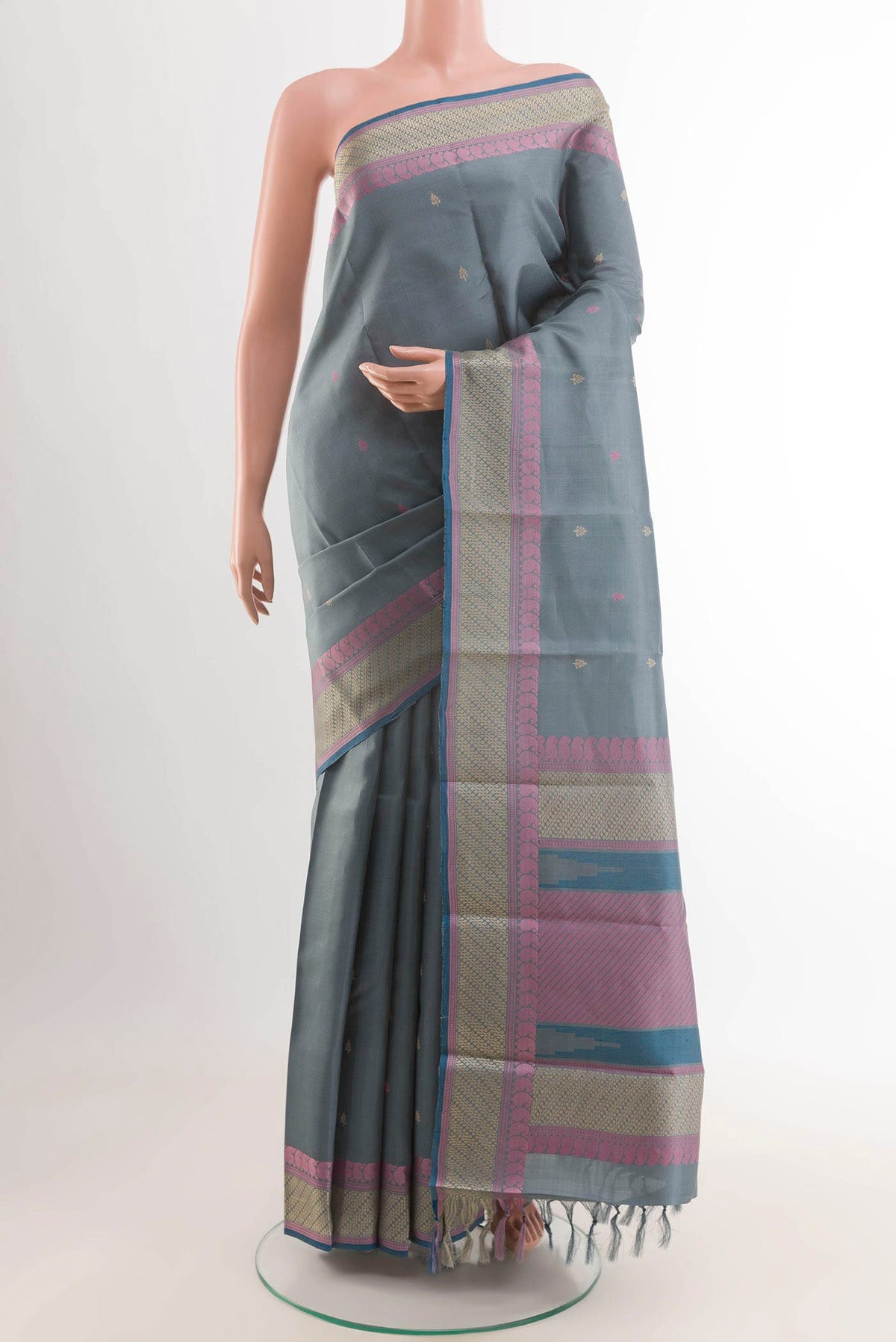 Grey Kanchipuram Silk Saree with Thread Butta on the body and Thread Embroidery Border displayed on a mannequin