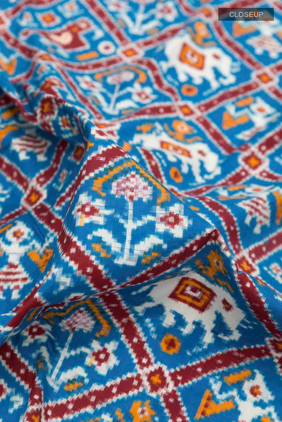 Close up of Blue Pochampally Silk Saree with Pure Ikat on the body and Ikat Border displaying folds