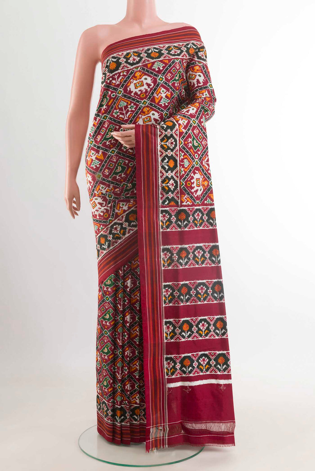 Maroon Pochampally Silk Saree with Pure Ikat on the body and Ikat Border displayed on a mannequin