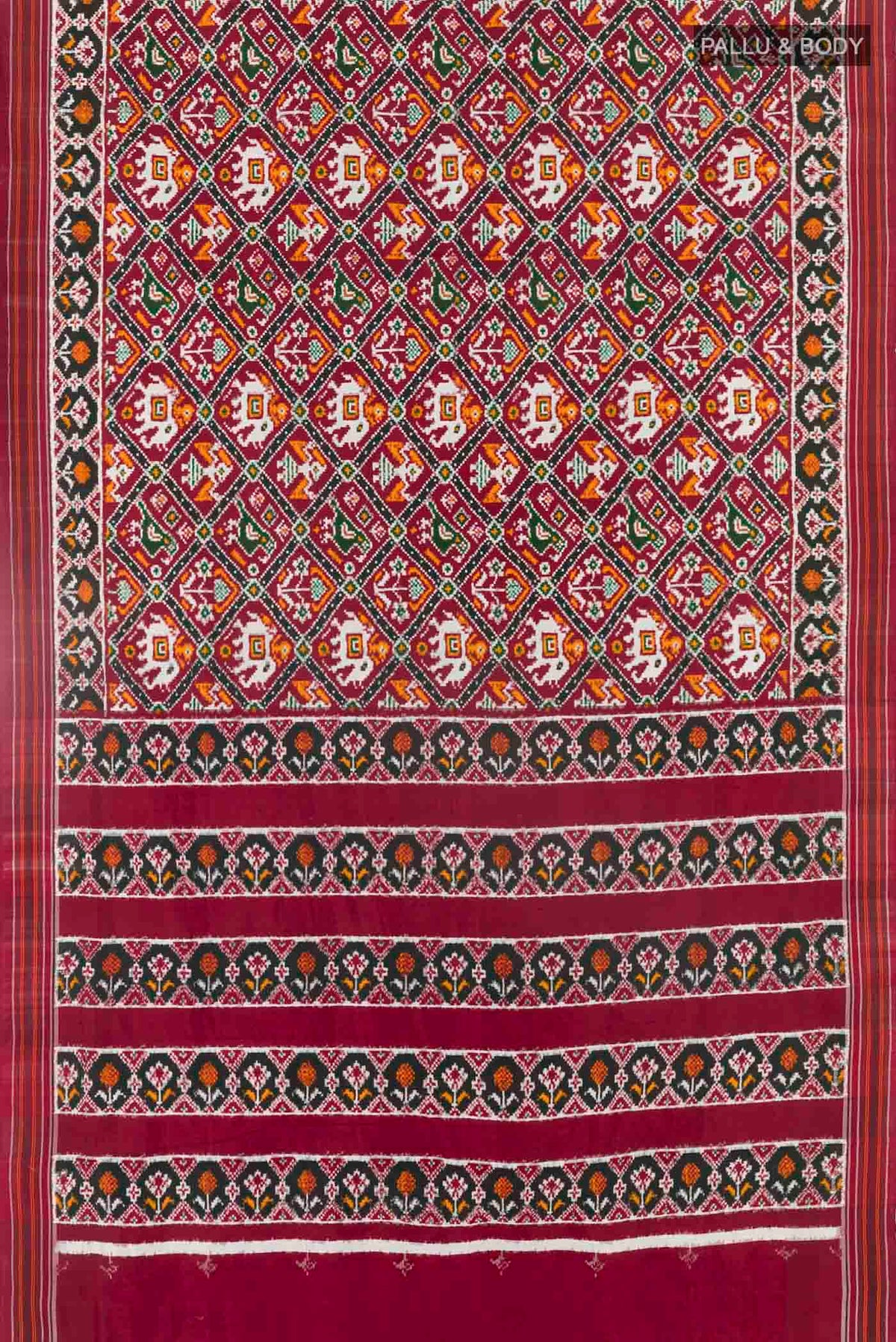 Flat view of Maroon Pochampally Silk Saree with Pure Ikat on the body and Ikat Border
