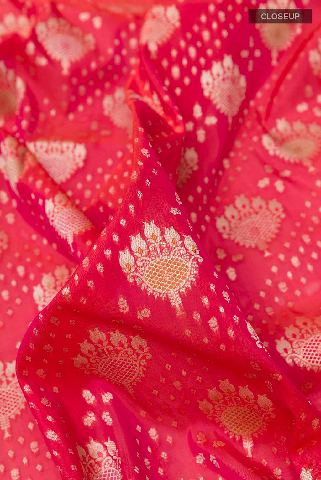 Close up of Red Banarasi Silk Saree with Zari Butta on the body and Zari Border displaying folds