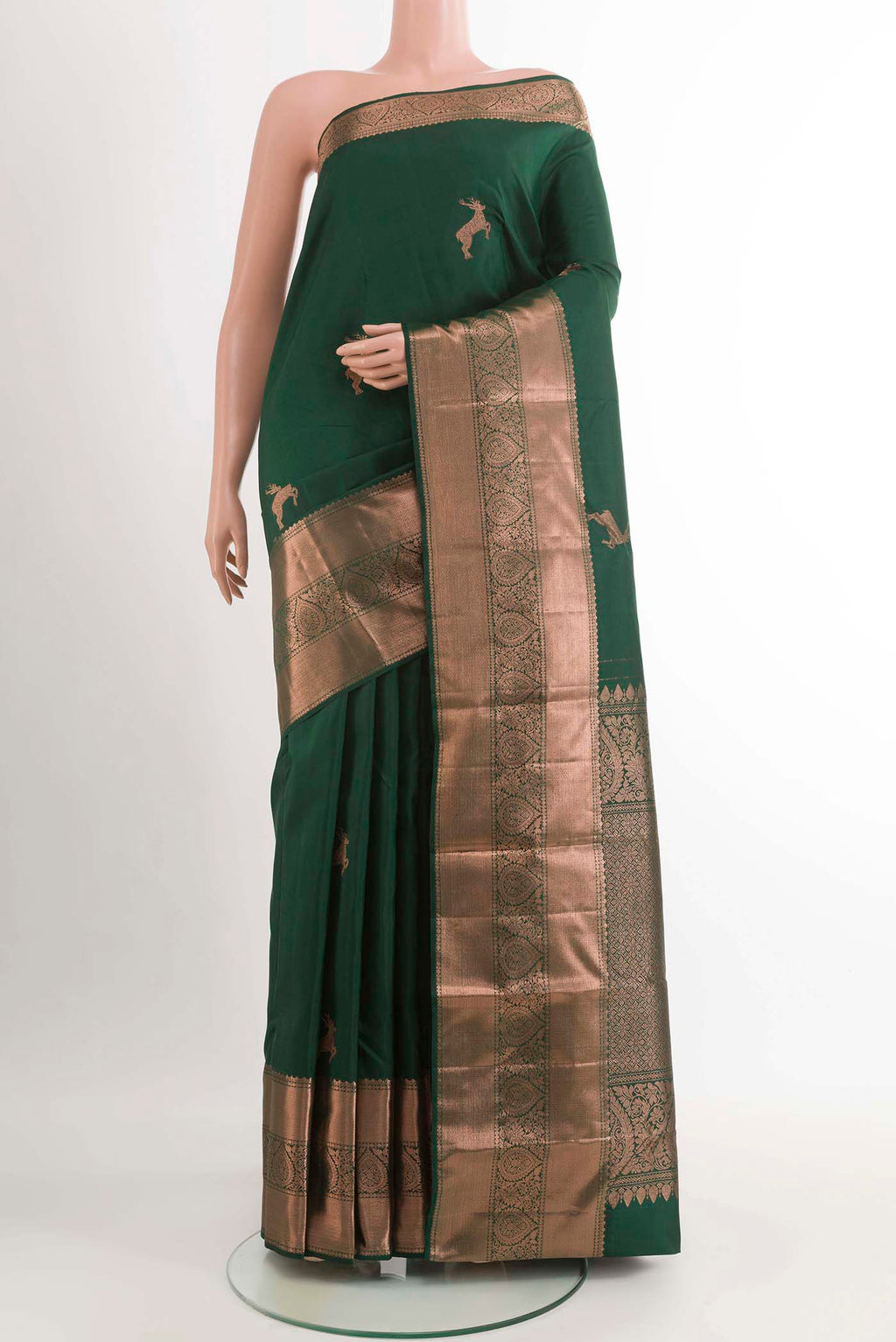 Green Kanchipuram Silk Saree with Zari Butta on the body and Zari Border displayed on a mannequin