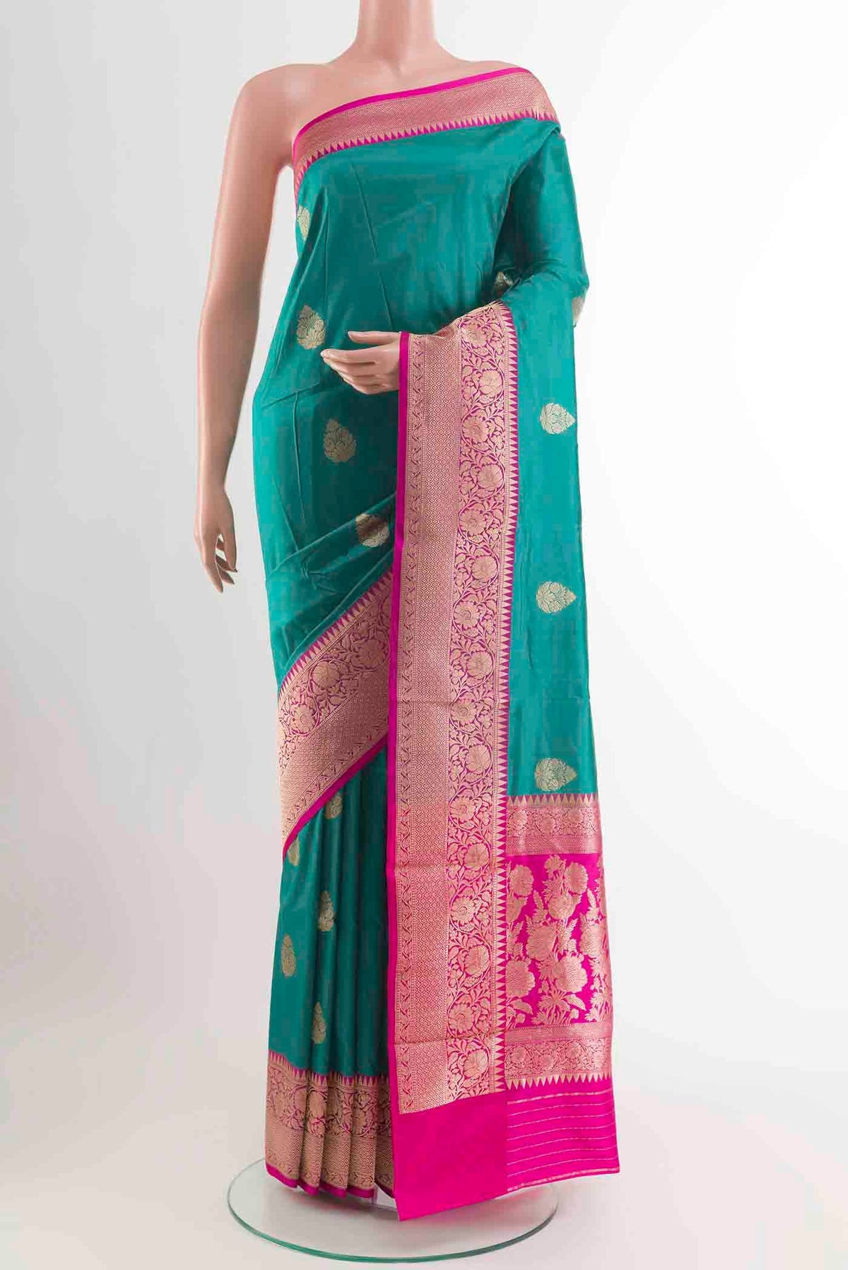 Sea Green Banarasi Katan Silk Saree with Zari Butta on the body and Zari Border displayed on a mannequin