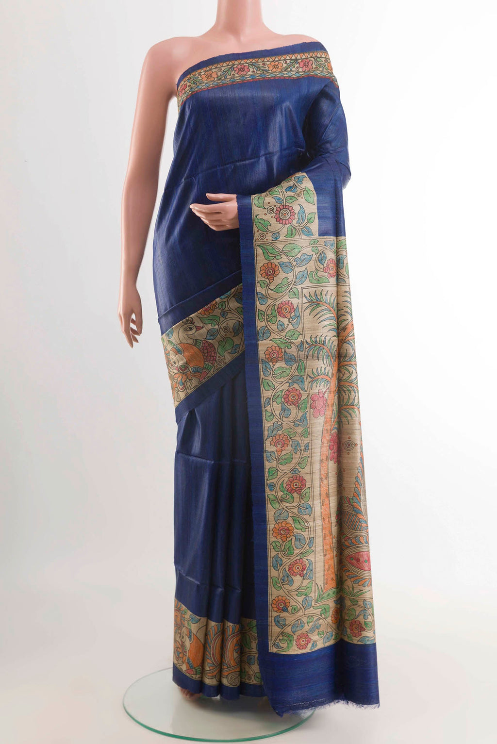 Blue Tussar Saree with Printed design on the body and Printed Border displayed on a mannequin