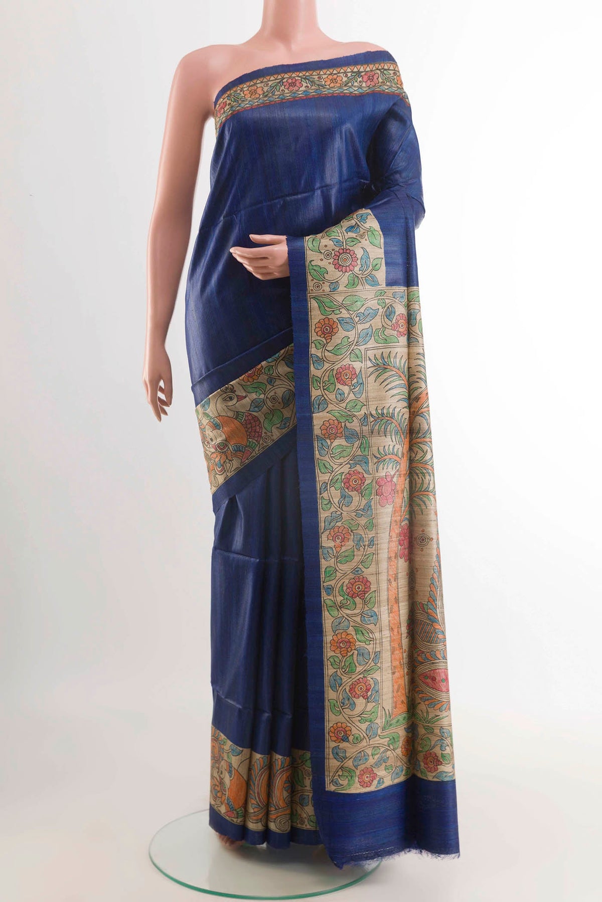 Blue Tussar Saree with Printed design on the body and Printed Border displayed on a mannequin