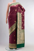 Maroon Banarasi Katan Silk Saree with Zari Butta on the body and Zari Border displayed on a mannequin