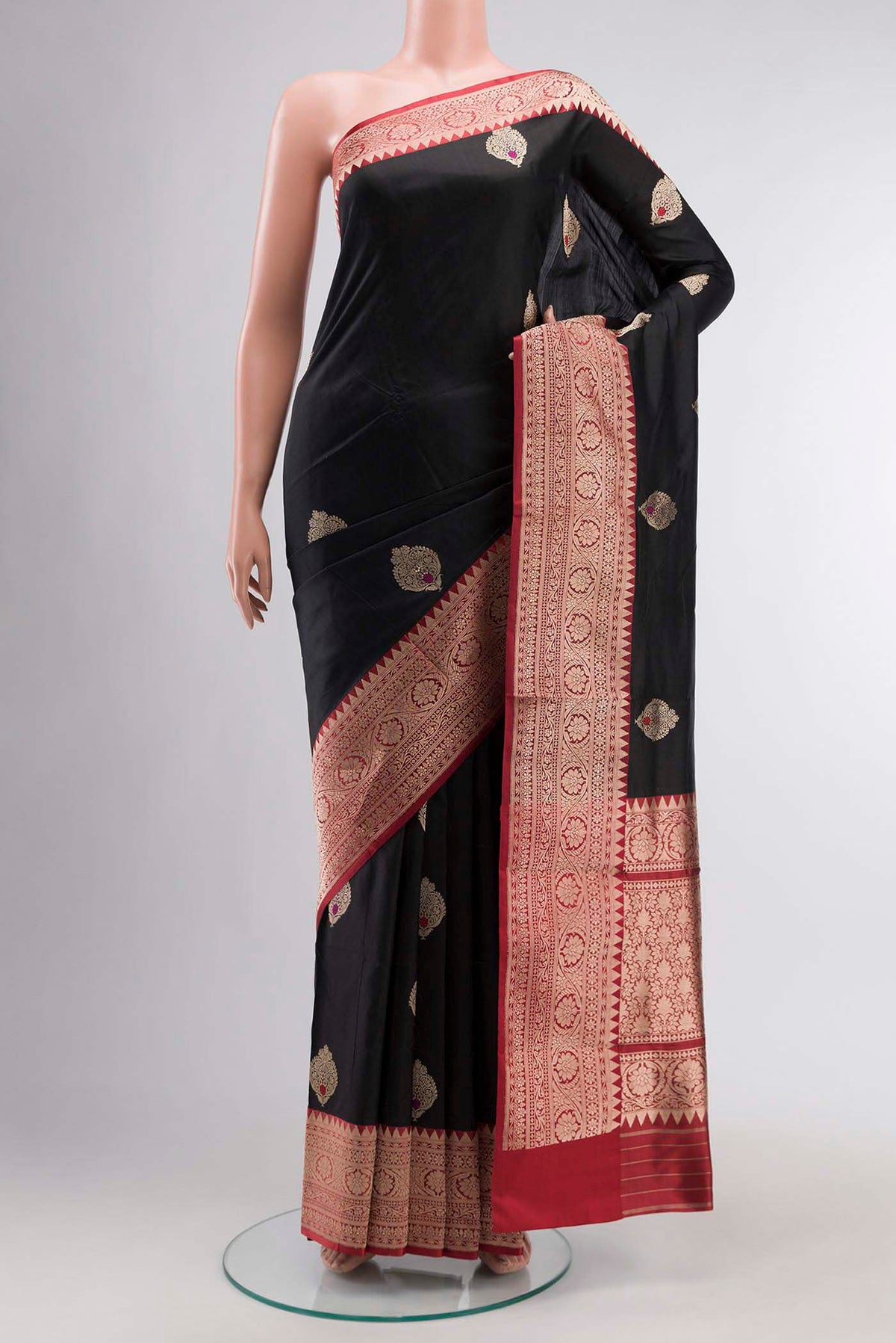 Black Banarasi Katan Silk Saree with Zari Butta on the body and Zari Border displayed on a mannequin