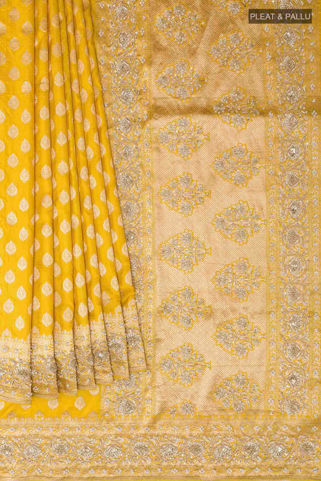 Pleats and pallu of Yellow Banarasi Silk Saree with Zari Butta on the body and Sequin Border