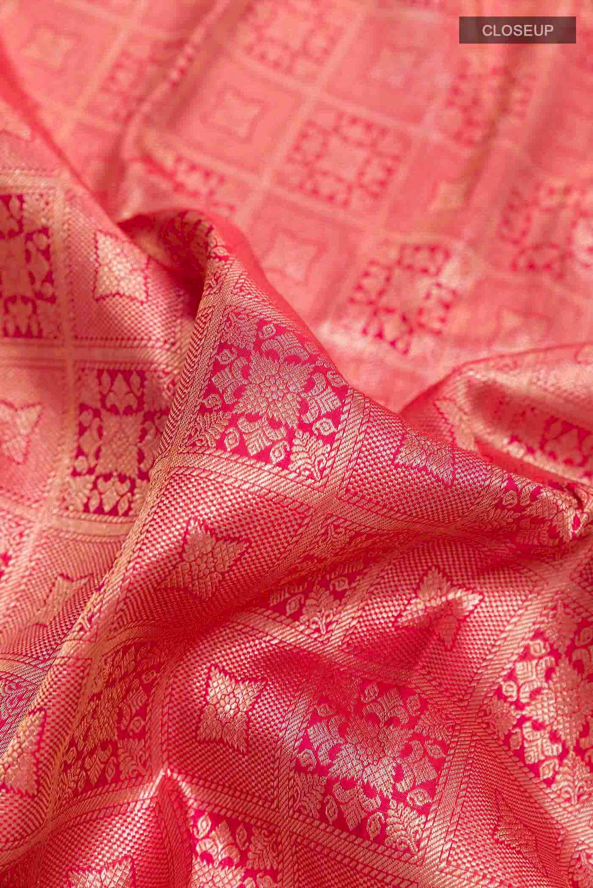 Close up of Red Kanchipuram Silk Saree with Zari Brocade on the body and Zari Border displaying folds