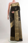 Black Kanchipuram Silk Saree with Zari Butta on the body and Zari Border displayed on a mannequin