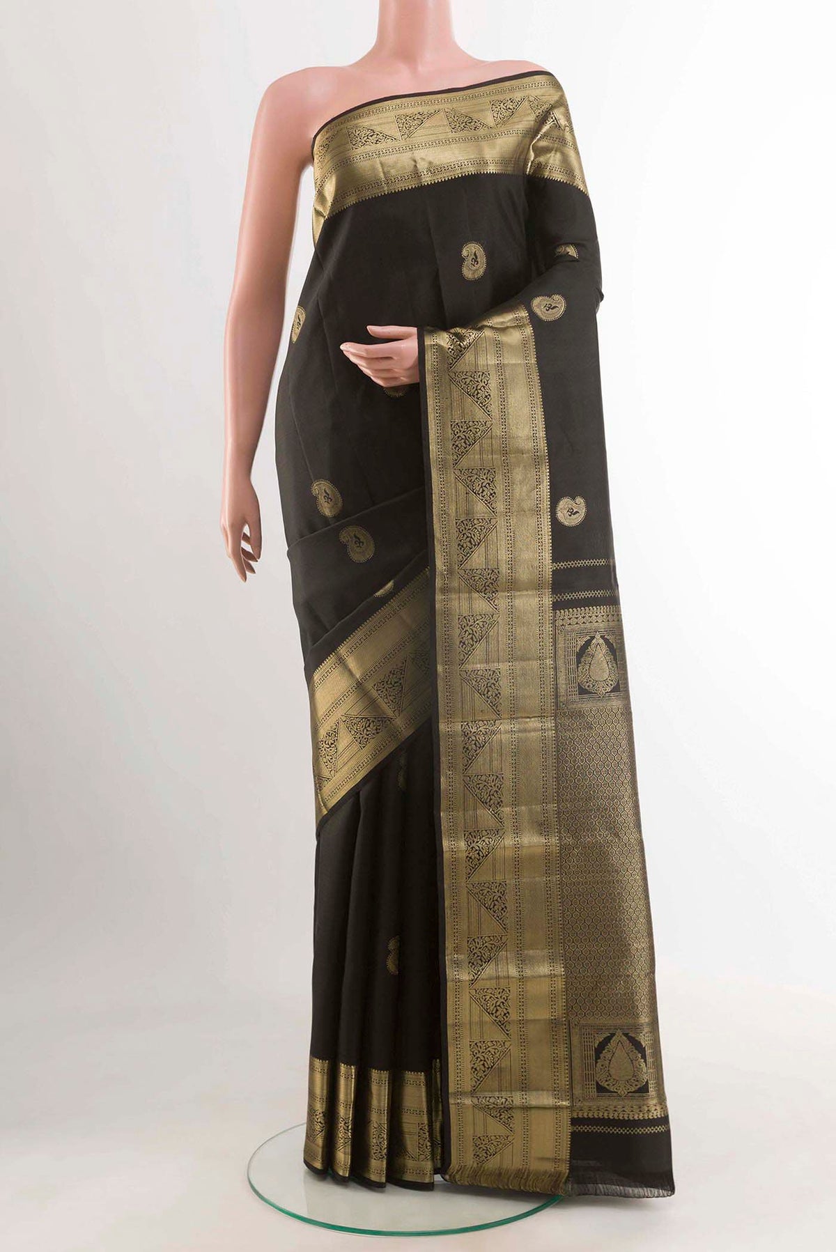 Black Kanchipuram Silk Saree with Zari Butta on the body and Zari Border displayed on a mannequin