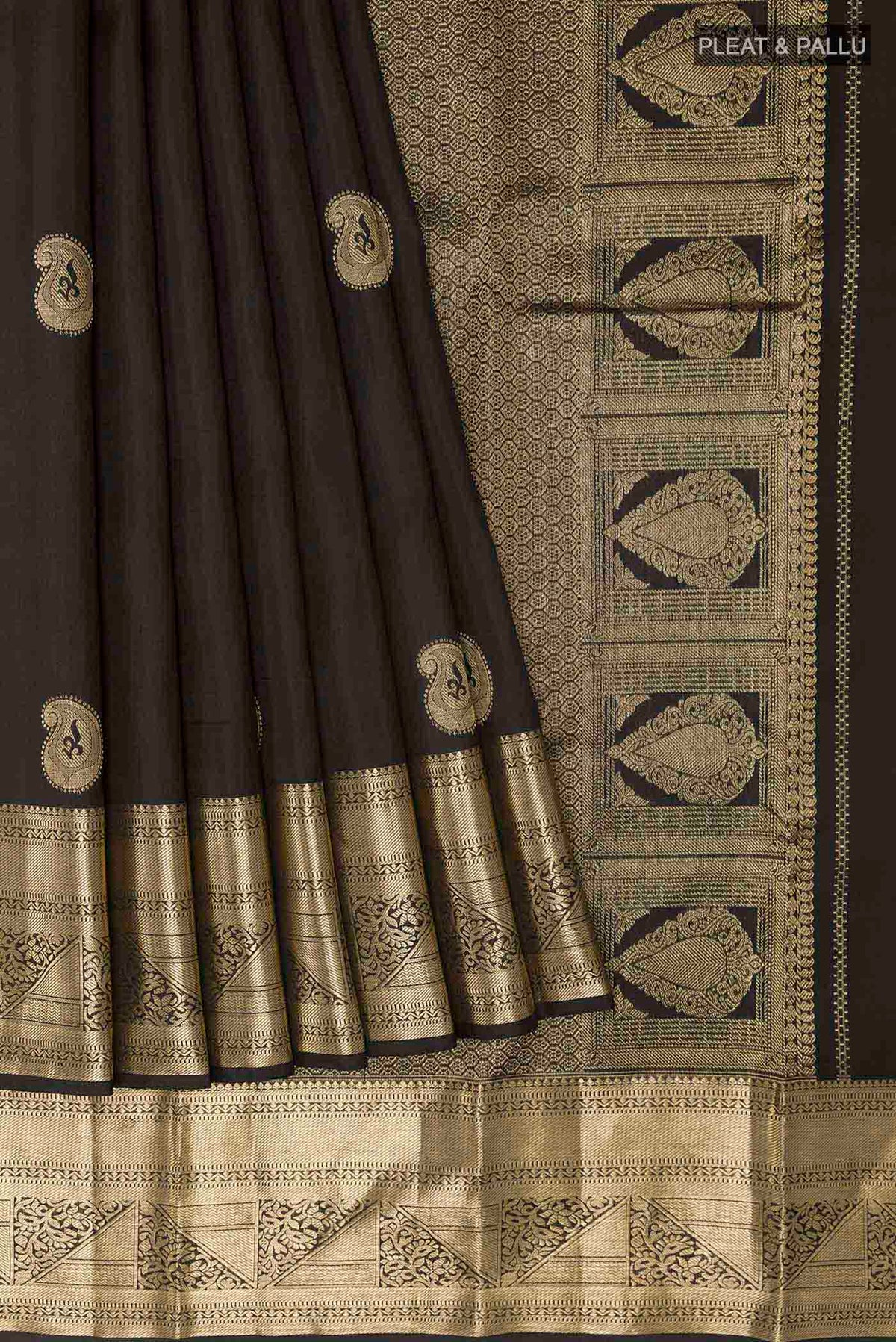 Pleats and pallu of Black Kanchipuram Silk Saree with Zari Butta on the body and Zari Border