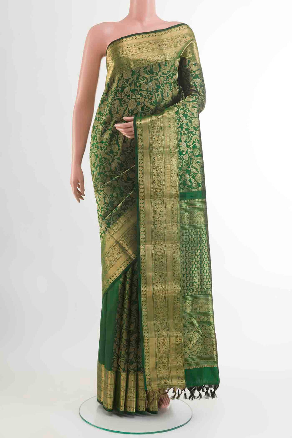 Green Kanchipuram Silk Saree with Zari Brocade on the body and Zari Border displayed on a mannequin