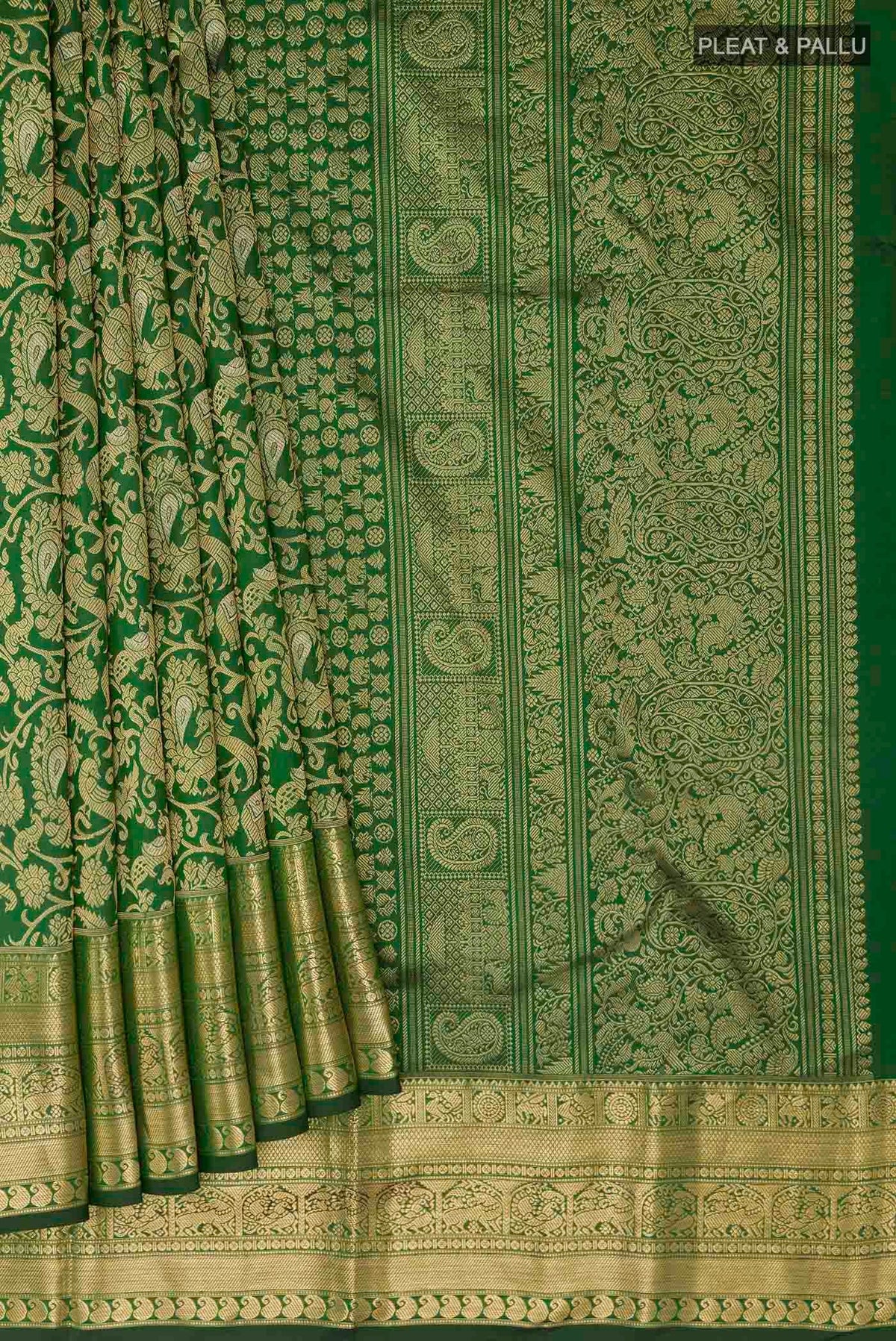 Pleats and pallu of Green Kanchipuram Silk Saree with Zari Brocade on the body and Zari Border