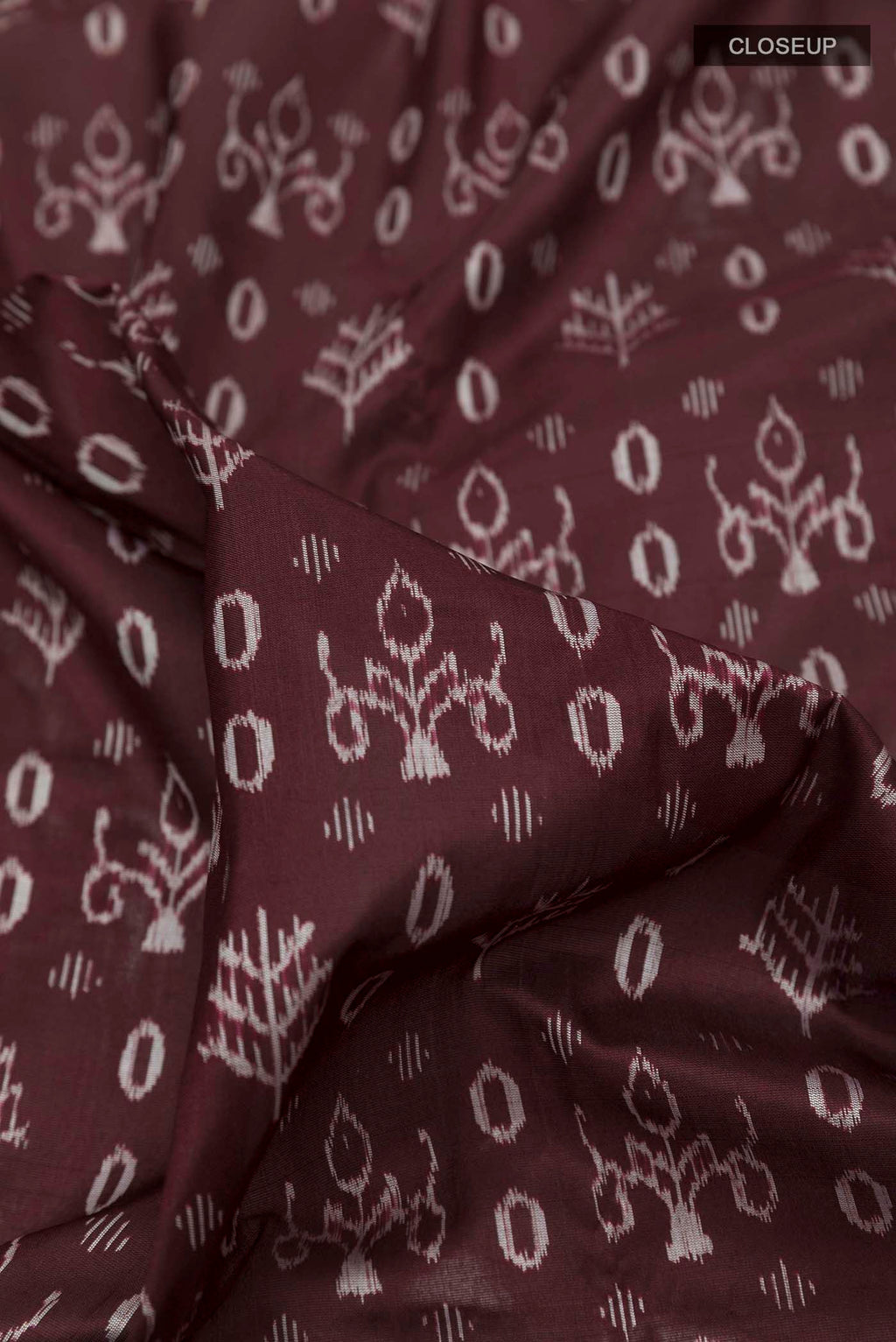 Close up of Brown Orissa Silk Saree with Pure Ikat on the body and Thread Border displaying folds