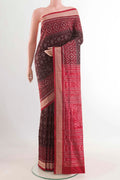 Brown Orissa Silk Saree with Pure Ikat on the body and Thread Border displayed on a mannequin