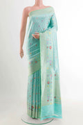 Turquoise Banarasi Saree with Zari Brocade on the body and Zari Border displayed on a mannequin