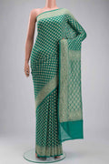 Green Banarasi Georgette Saree with Zari Butta on the body and Zari Border displayed on a mannequin