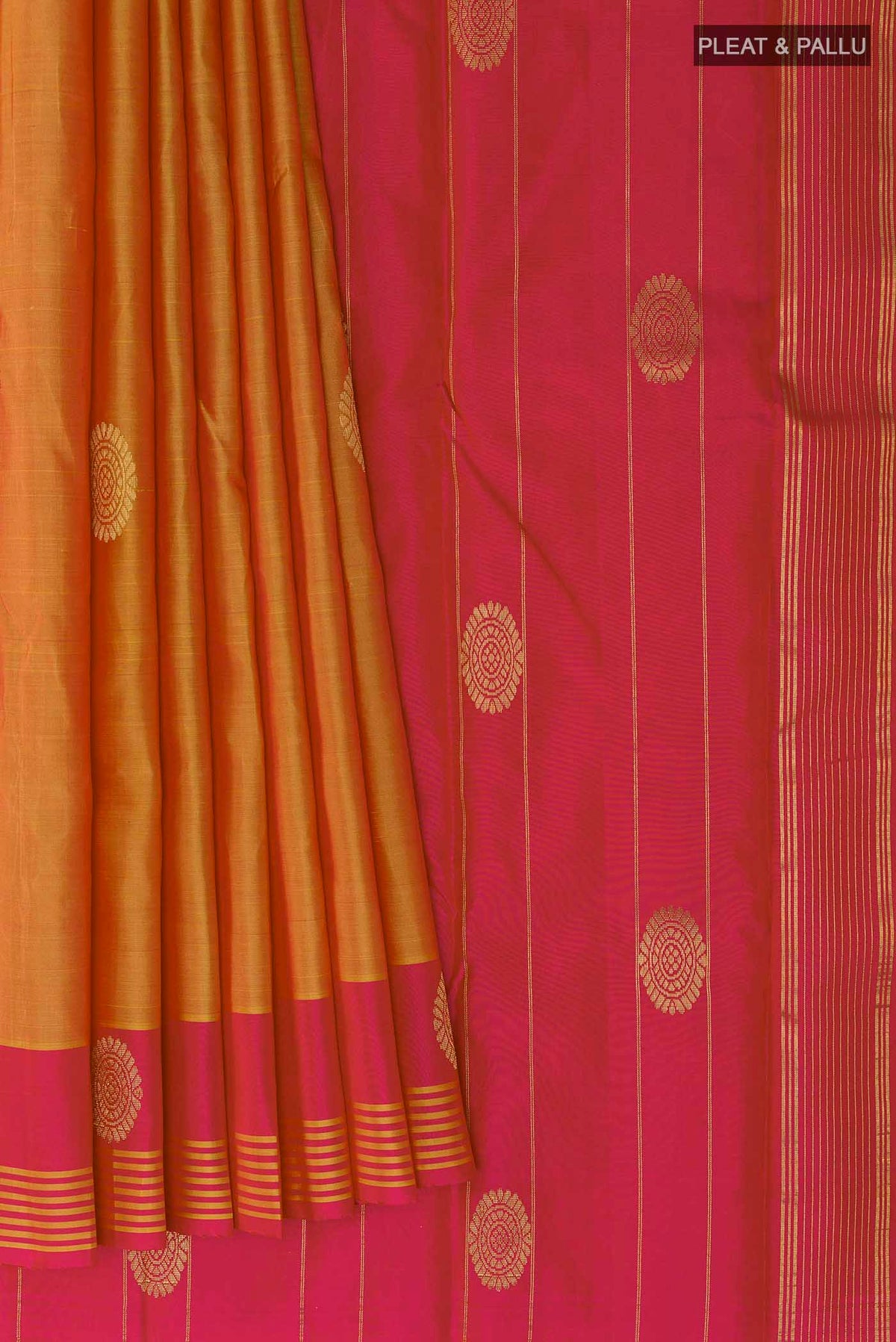 Pleats and pallu of Orange Kanchipuram Silk Saree with Zari Butta on the body and Zari Border