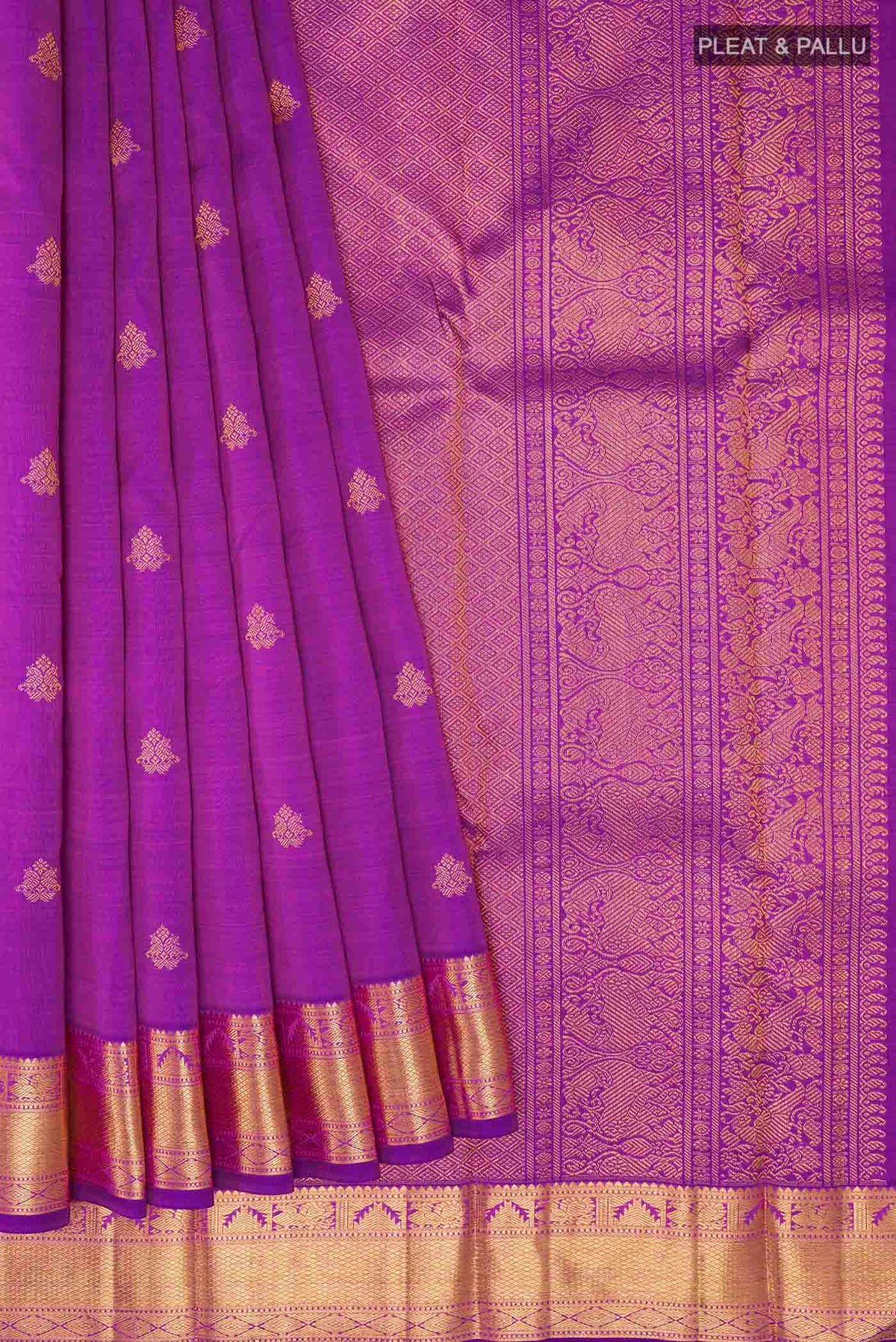 Pleats and pallu of Purple Kanchipuram Silk Saree with Zari Butta on the body and Zari Border