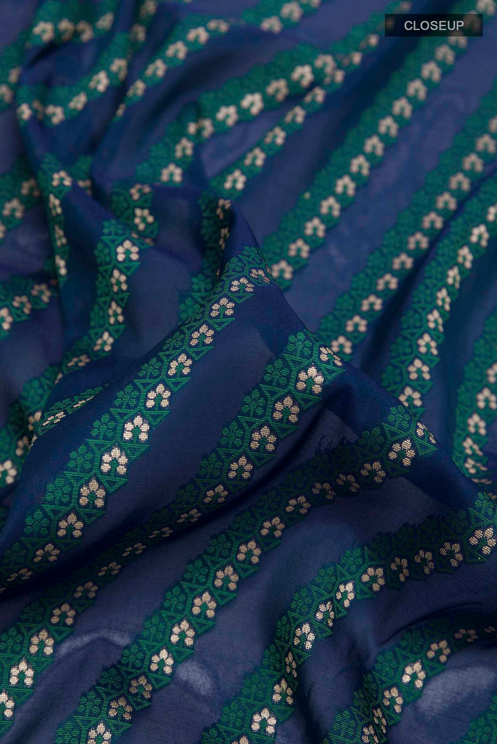 Close up of Blue Banarasi Silk Saree with Stripes on the body and Zari Border displaying folds