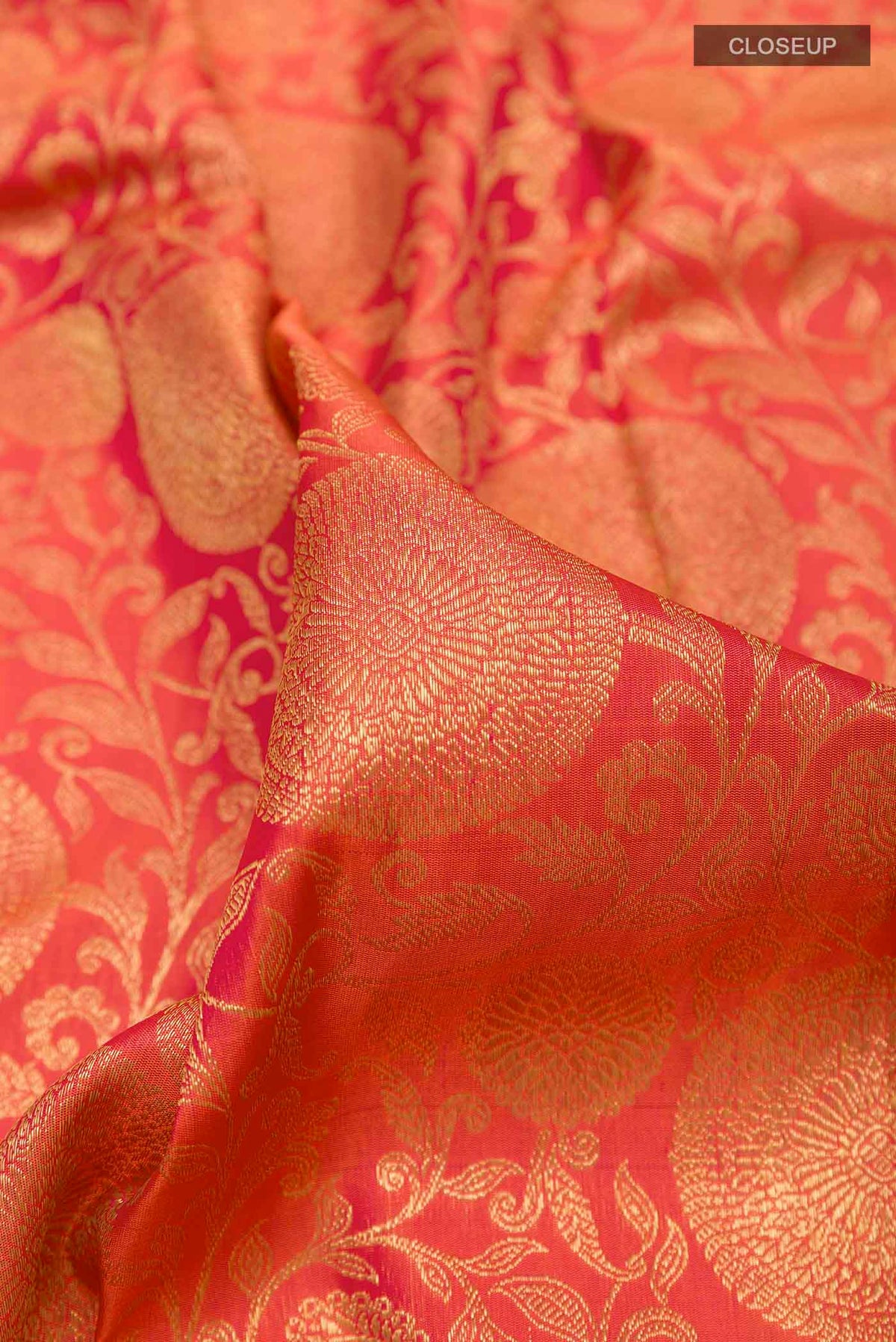 Close up of Red Kanchipuram Silk Saree with Zari Brocade on the body and Zari Border displaying folds