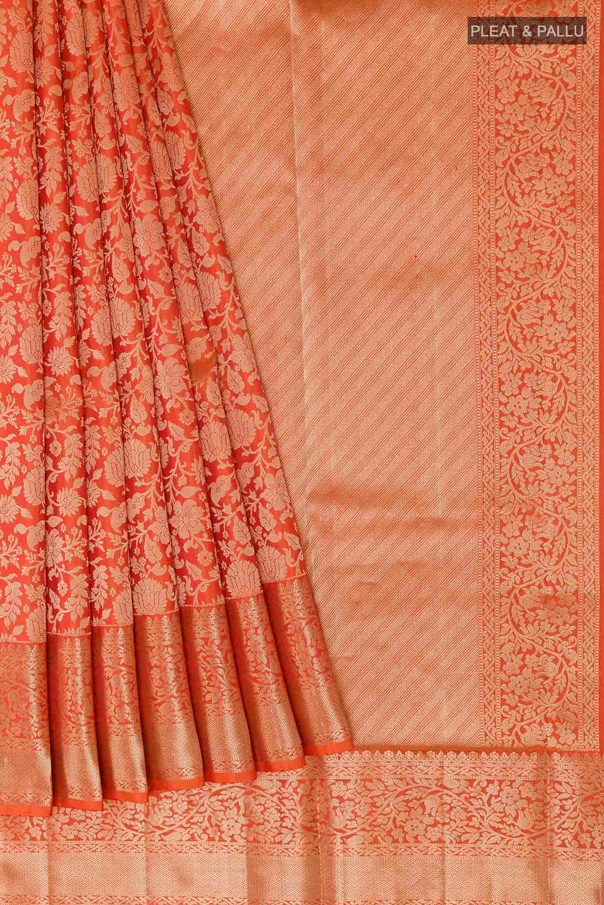 Pleats and pallu of Orange Soft Silk Saree with Zari Brocade on the body and Zari Border