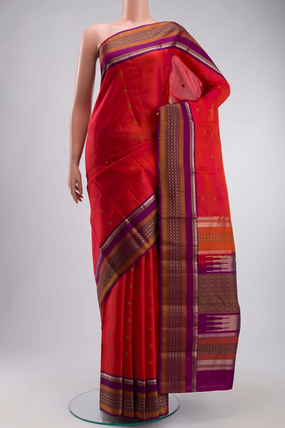 Pink with Orange Color Kanchipuram Silk Saree with Thread Butta on the body and Zari And Thread Border displayed on a mannequin