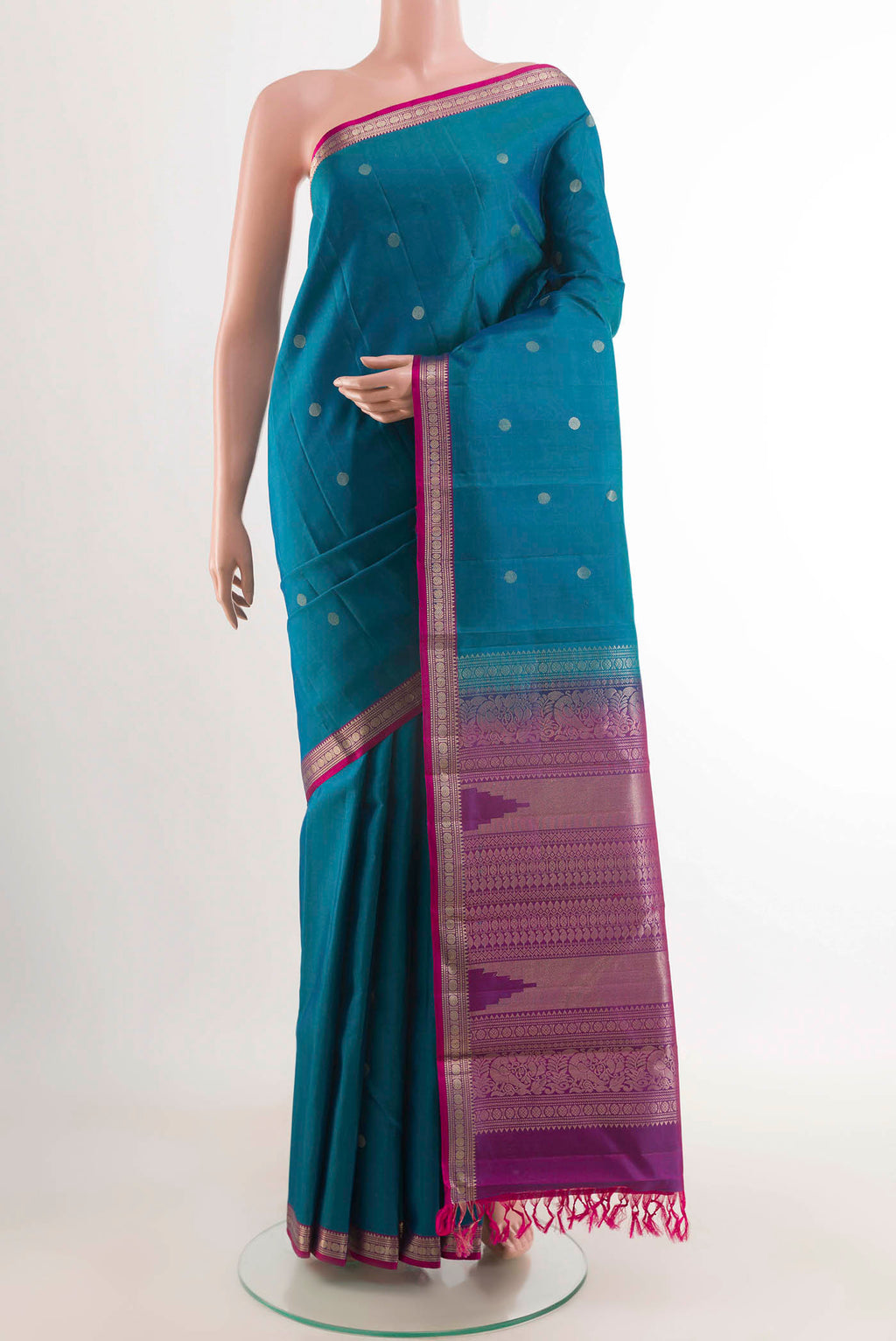 Blue Kanchipuram Silk Saree with Zari Butta on the body and Zari Border displayed on a mannequin